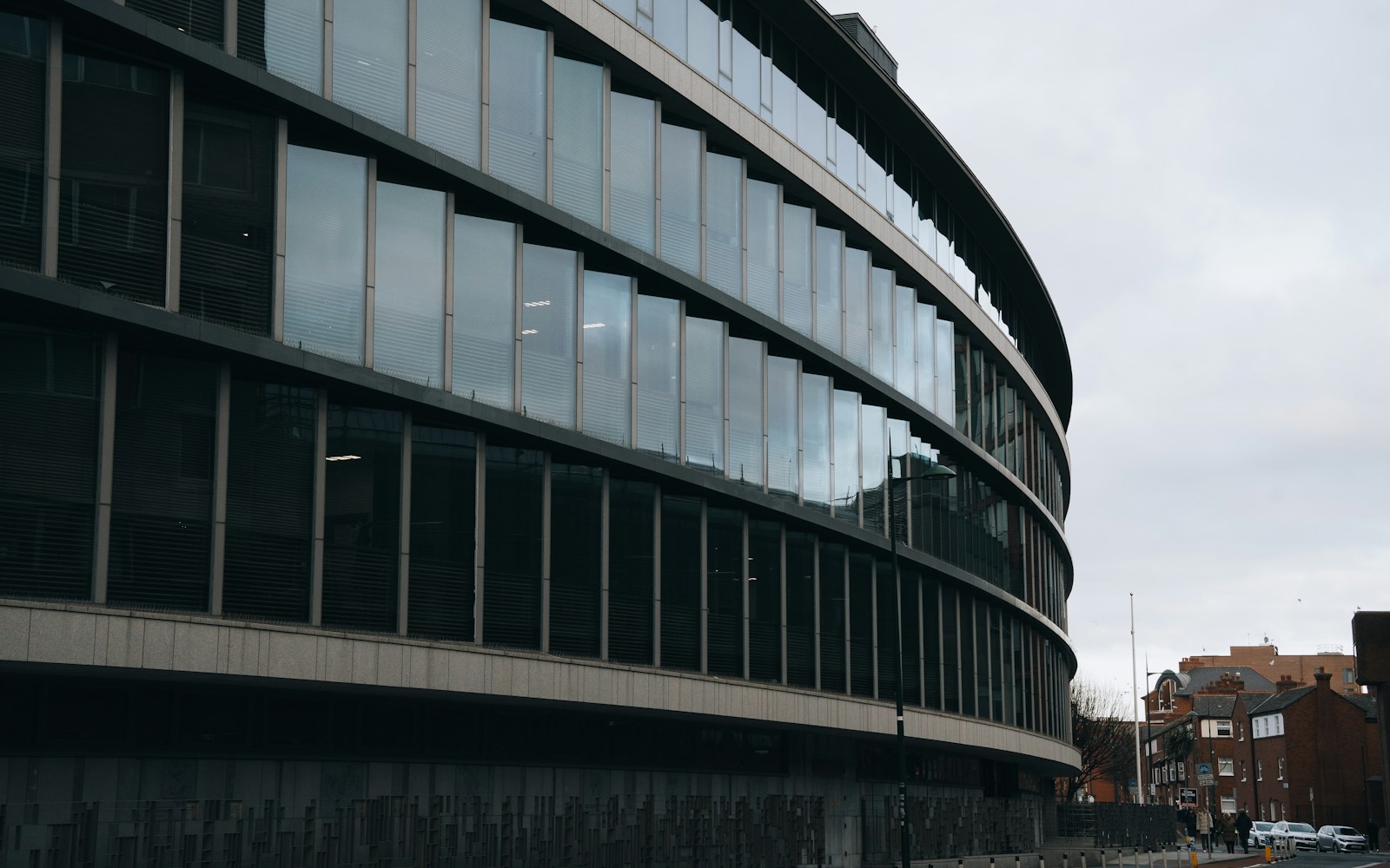 Contemporary curved commercial building in an established business district.